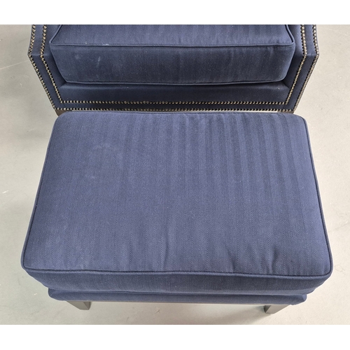 310 - WINGBACK CHAIR AND FOOTSTOOL (2). in blue herringbone fabric 76cm w x 103cm t and a small footstool ... 