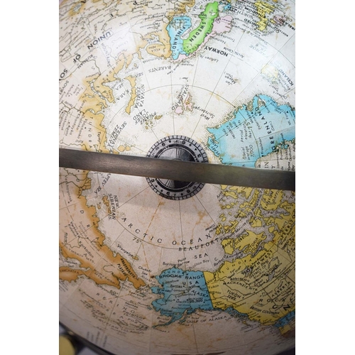 315 - A FLOOR GLOBE. mounted on a chrome and brass frame. c.1970's. 85cm h x 55cm w.