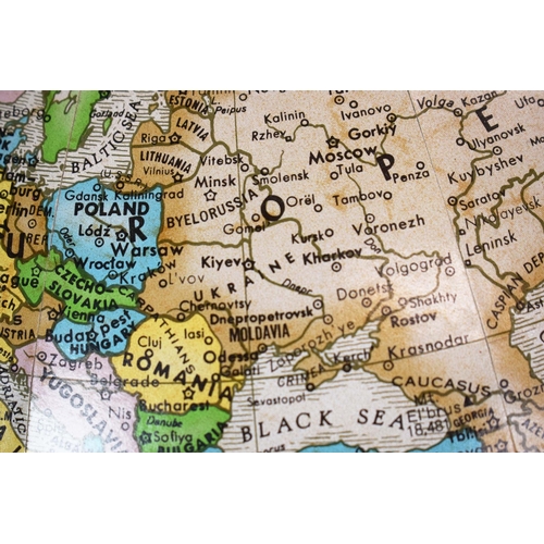 315 - A FLOOR GLOBE. mounted on a chrome and brass frame. c.1970's. 85cm h x 55cm w.