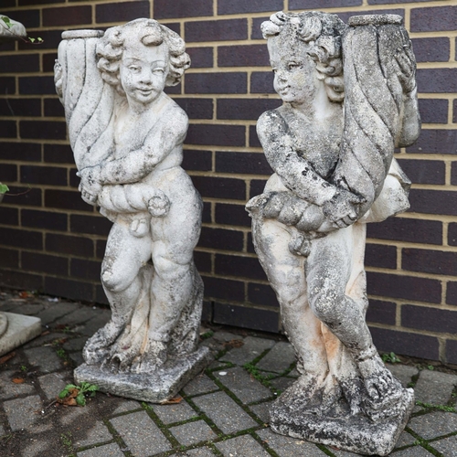 318 - WEATHERED STONE PUTTI (2). a pair.