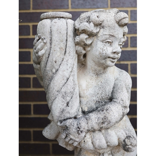 318 - WEATHERED STONE PUTTI (2). a pair.