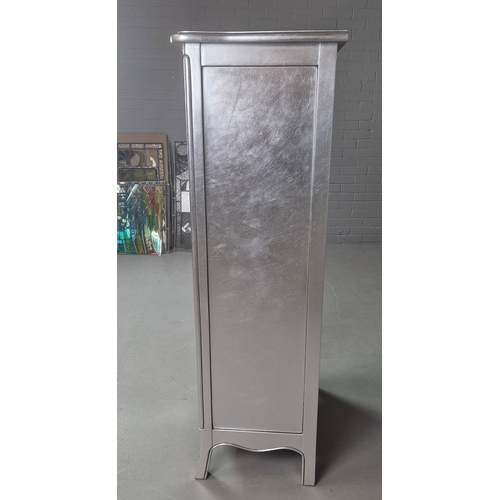 324 - SILVERED TALL CHEST. of serpentine form 65cm w x 46cm d x 137cm t.