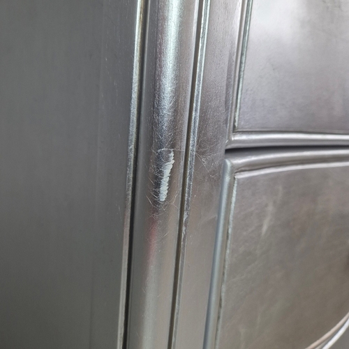 324 - SILVERED TALL CHEST. of serpentine form 65cm w x 46cm d x 137cm t.