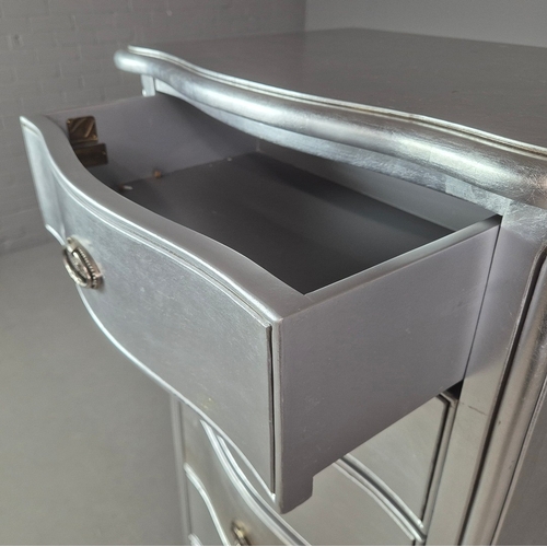 324 - SILVERED TALL CHEST. of serpentine form 65cm w x 46cm d x 137cm t.