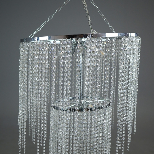 342 - CHANDELIER. polished metal frame with drops hiding 2 tiered lighting.