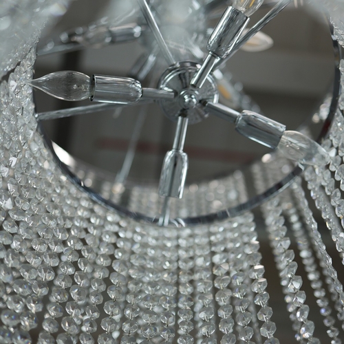 342 - CHANDELIER. polished metal frame with drops hiding 2 tiered lighting.