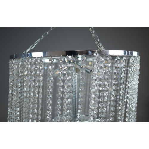 342 - CHANDELIER. polished metal frame with drops hiding 2 tiered lighting.