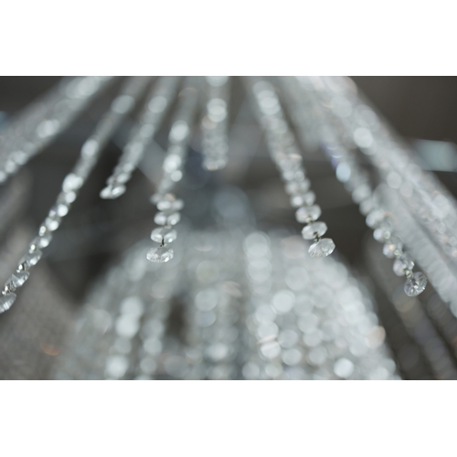 342 - CHANDELIER. polished metal frame with drops hiding 2 tiered lighting.