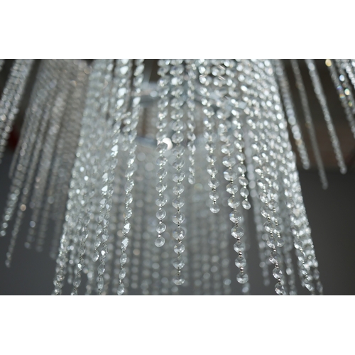 342 - CHANDELIER. polished metal frame with drops hiding 2 tiered lighting.