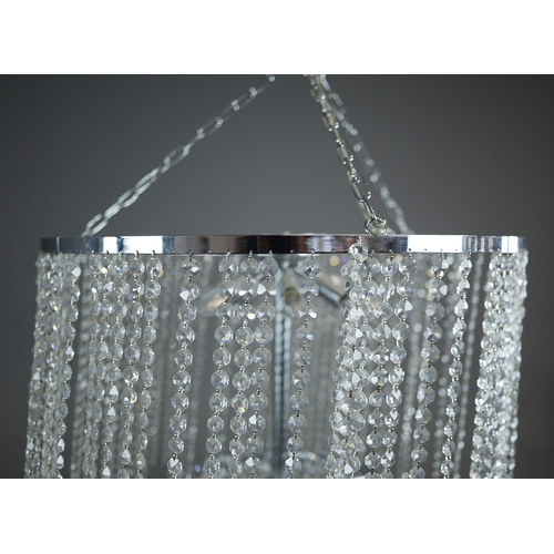 342 - CHANDELIER. polished metal frame with drops hiding 2 tiered lighting.