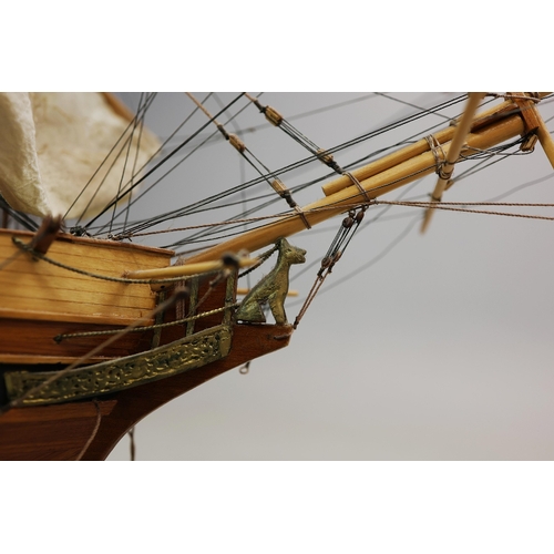 349 - MODEL OF A SQUARE RIGGED SHIP. on a small stand, plaque reads 