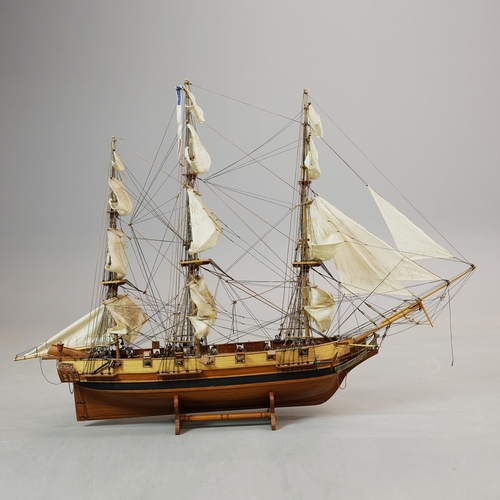 349 - MODEL OF A SQUARE RIGGED SHIP. on a small stand, plaque reads 