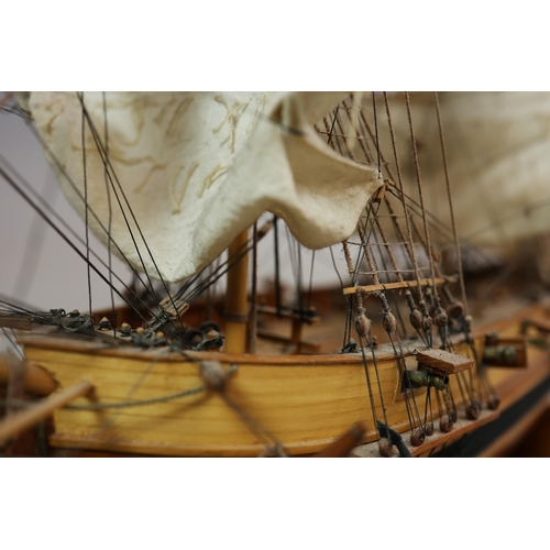 349 - MODEL OF A SQUARE RIGGED SHIP. on a small stand, plaque reads 