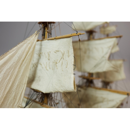 349 - MODEL OF A SQUARE RIGGED SHIP. on a small stand, plaque reads 