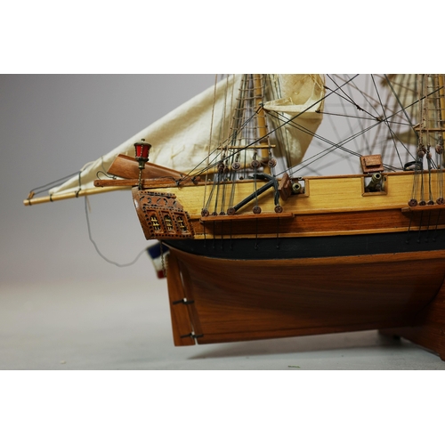 349 - MODEL OF A SQUARE RIGGED SHIP. on a small stand, plaque reads 