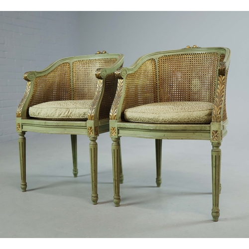 350 - DOUBLE CANED TUB CHAIRS, A PAIR. early 20th century French with green painted show frames and carved... 