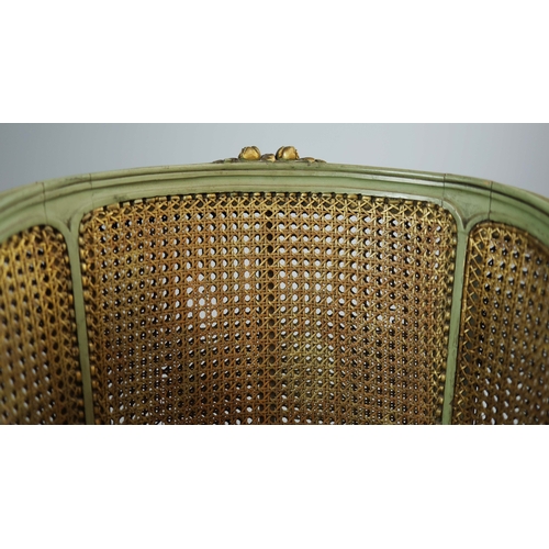 350 - DOUBLE CANED TUB CHAIRS, A PAIR. early 20th century French with green painted show frames and carved... 