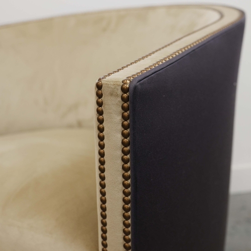 356 - ARMCHAIR, WITH A CURVED BACK. and studded detail, with a contrast back 76cm w x 80cm t.