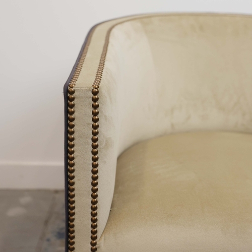 356 - ARMCHAIR, WITH A CURVED BACK. and studded detail, with a contrast back 76cm w x 80cm t.