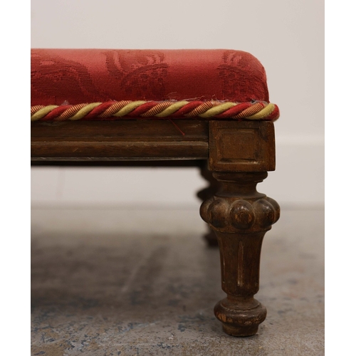 358 - 19TH CENTURY FRENCH BEECHWOOD HEARTH STOOL. long and low in crimson damask with six decoratively car... 