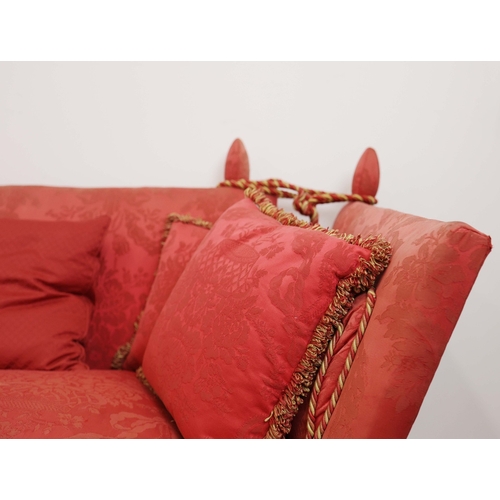 359 - KNOLE SOFA. with drop ends in crimson damask, with bullion fringe 88cm t x 158cm w x 86cm d.