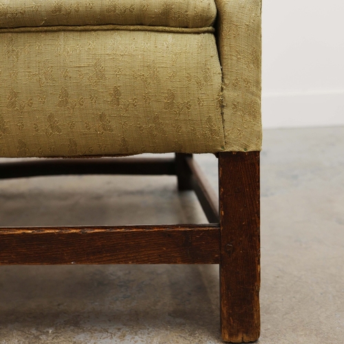 360 - GEORGE III ELM WING ARMCHAIR. Circa 1800, in green patterned upholstery 83cmw x 123cm t.