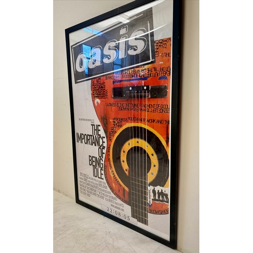 88 - THE IMPORTANCE OF BEING IDLE OASIS POSTER. framed and glazed, 160cm H x 108cm W.