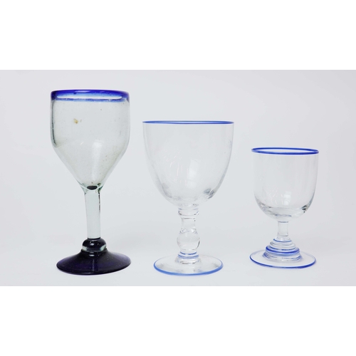 A LARGE COLLECTION OF BLUE RIMMED GLASSWARE (QTY). to include plates ...