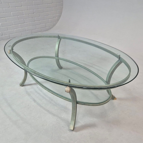 695 - PIERRE VANDAL COFFEE TABLE. the oval glass top on a verdigris base 80cm w x 46cm d x 136cm w.