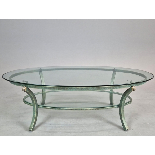 695 - PIERRE VANDAL COFFEE TABLE. the oval glass top on a verdigris base 80cm w x 46cm d x 136cm w.