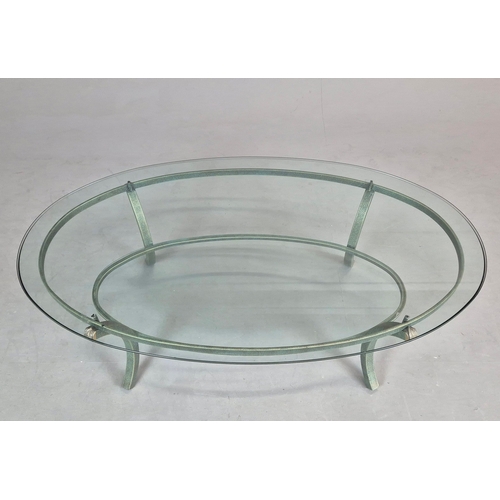 695 - PIERRE VANDAL COFFEE TABLE. the oval glass top on a verdigris base 80cm w x 46cm d x 136cm w.