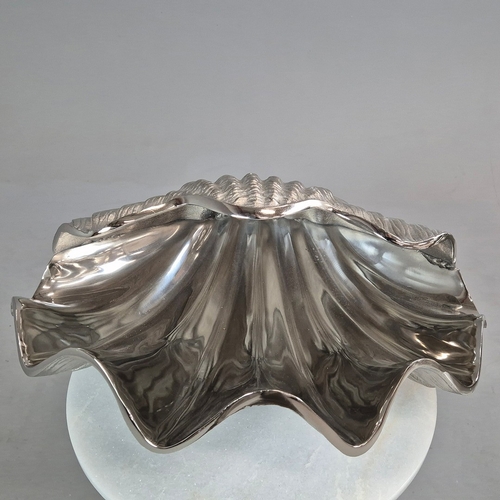 719 - PAIR OF POLISHED METAL CLAM SHELL DISHES. 18cm H x 46cm W x 36cm D.