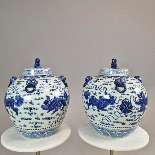 721 - PAIR OF BLUE AND WHITE CHINESE CERAMIC LIDDED JARS. 42cm H x 34cm W.