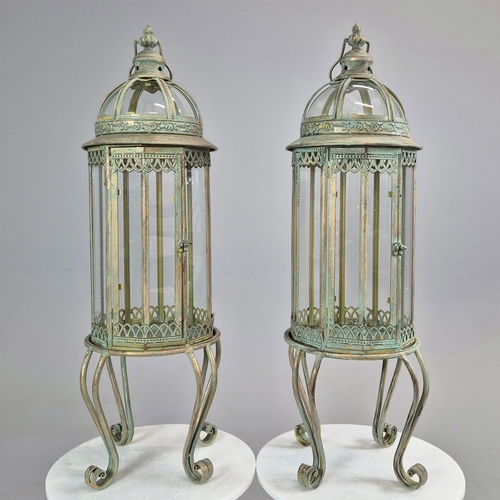 730 - PAIR OF LANTERNS ON STANDS IN VERDIGRIS FINISH METAL AND GLASS. 80cm H x 28cm W.