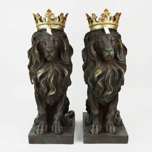 736 - PAIR OF SEATED CROWNED LIONS. Resin
58cm H x 22cm W x 30cm D.