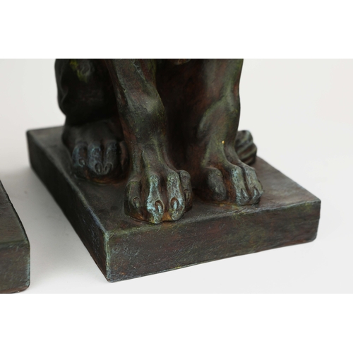 736 - PAIR OF SEATED CROWNED LIONS. Resin
58cm H x 22cm W x 30cm D.