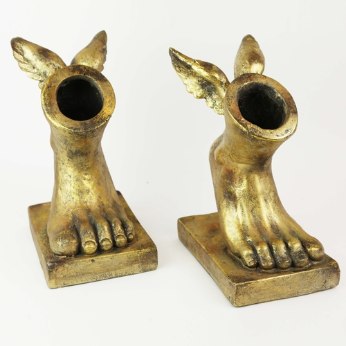 738 - PAIR OF GILT WINGED FEET PLANTERS. In resin
35cm H x 17cm W x 24cm D.