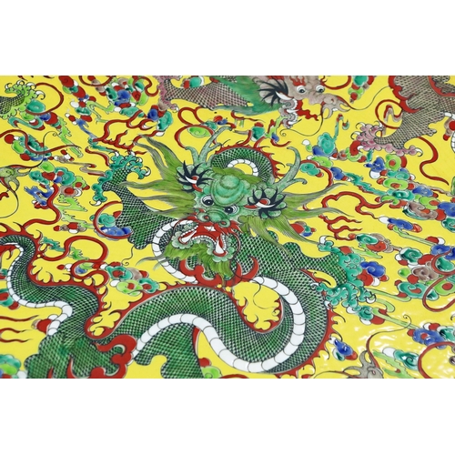 742 - LARGE CHINESE FAMILLE ROSE STYLE CERAMIC DRAGON CHARGER. 95cm W.