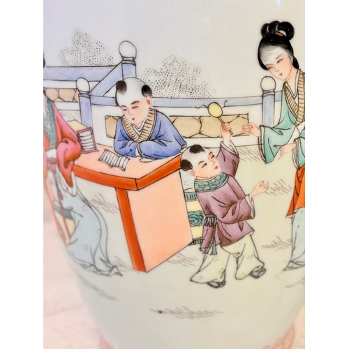 10 - PAIR OF CHINESE CERAMIC VASES WITH DECORATIVE SCENES. 46cm H x 19cm W.