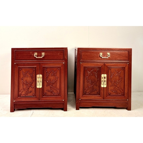 15 - PAIR OF CHINESE TEAK BEDSIDE CABINETS WITH CARVED PANEL DOORS BY GEORGE ZEE. 60cm H x 56cm W x 46cm ... 