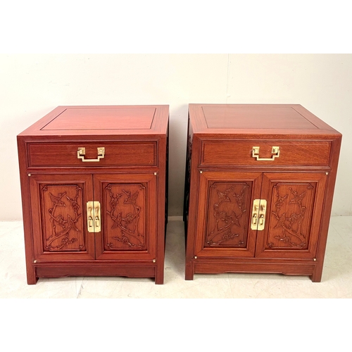 15 - PAIR OF CHINESE TEAK BEDSIDE CABINETS WITH CARVED PANEL DOORS BY GEORGE ZEE. 60cm H x 56cm W x 46cm ... 