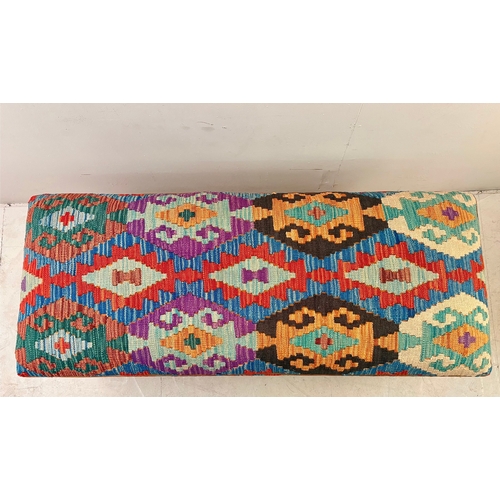 23 - HEARTH STOOL WITH KILIM UPHOLSTERY ON TURNED SUPPORTS. 52cm H x 123cm W x 50cm D.