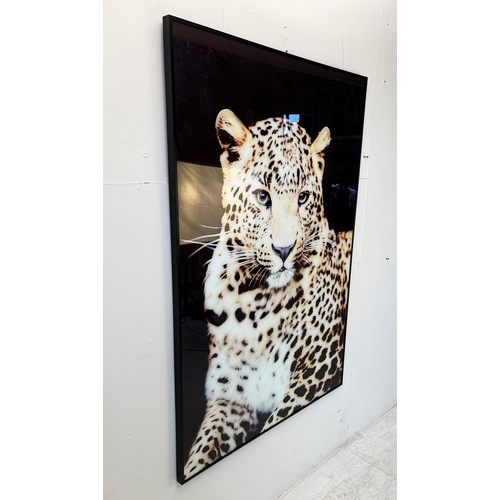 24 - PHOTOGRAPHIC PRINT ON GLASS OF A LEOPARD. 120cm H x 82cm W.
