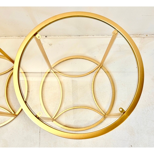 28 - PAIR OF OCCASIONAL TABLES. in gilt metal with circular glass tops, 47cm H x 38cm W.