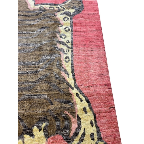 288 - TIBETAN TIGER CARPET. 284cm x 198cm.