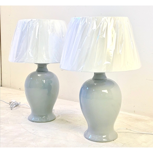 31 - PAIR OF GREY CERAMIC TABLE LAMPS WITH WHITE SHADES. 55cm H x 35cmW.
