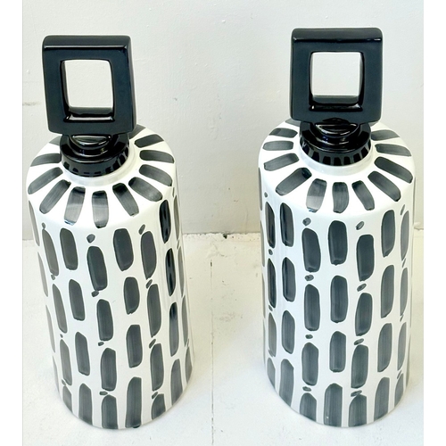 34 - PAIR OF BLACK AND WHITE CERAMIC LIDDED JARS. 45cm H x 14cm W.