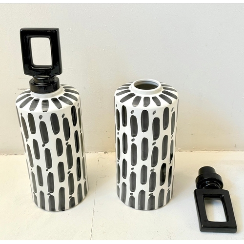 34 - PAIR OF BLACK AND WHITE CERAMIC LIDDED JARS. 45cm H x 14cm W.