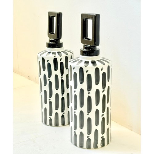34 - PAIR OF BLACK AND WHITE CERAMIC LIDDED JARS. 45cm H x 14cm W.