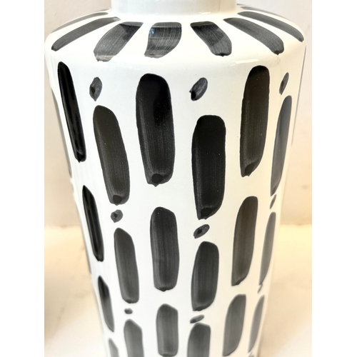 34 - PAIR OF BLACK AND WHITE CERAMIC LIDDED JARS. 45cm H x 14cm W.